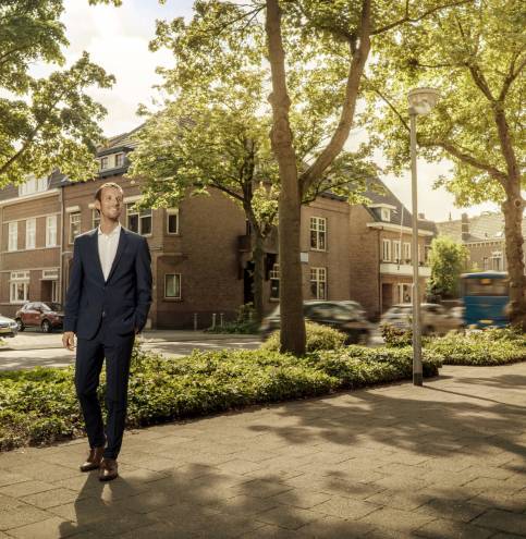 Netherlands, Venlo, confident businessman standing on pavement